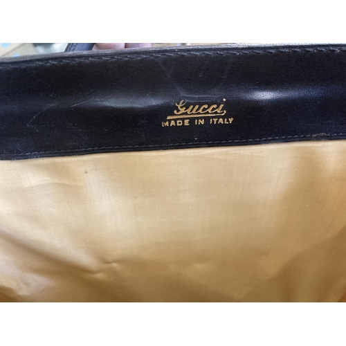 1613 - VINTAGE GUCCI LEATHER LUGGAGE purchased circa 1971, including a leather travelling bag with brass ca... 