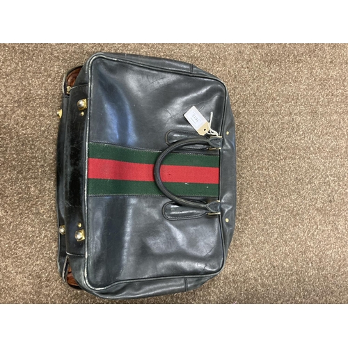 1613 - VINTAGE GUCCI LEATHER LUGGAGE purchased circa 1971, including a leather travelling bag with brass ca... 