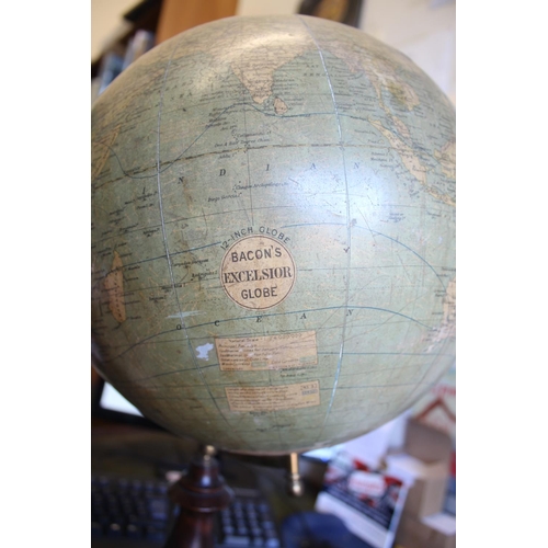 1452 - BACON'S EXCELSIOR TERRESTRIAL GLOBE a 12 inch terrestrial table globe mounted on a turned wooden sta... 