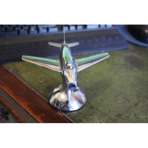 1465 - DUNHILL NOVELY TABLE LIGHTER - AEROPLANE a chrome lighter in the form of an aeroplane, 16cms long... 