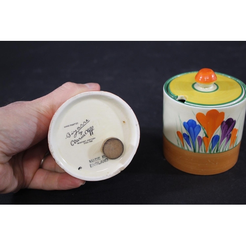 905 - CLARICE CLIFF SUGAR SIFTER a conical shaped sugar sifter in the Crocus design, also with a lidded pr... 