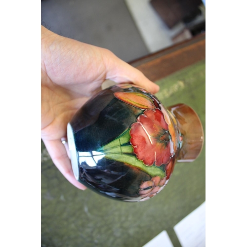 899 - MOORCROFT FLAMBE VASE - ORCHID a squat vase painted in the Orchid design, and with a flambe glaze. M... 