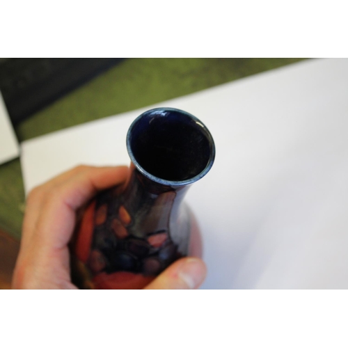 900 - MOORCROFT POMEGRANATE including a pomegranate bottle shaped vase (16cms high), a small pomegranate b... 