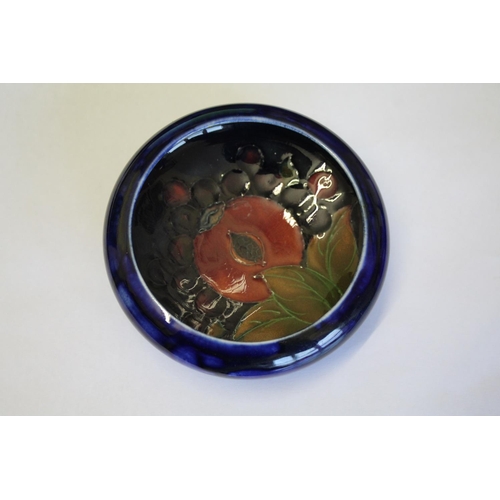 900 - MOORCROFT POMEGRANATE including a pomegranate bottle shaped vase (16cms high), a small pomegranate b... 