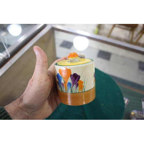 905 - CLARICE CLIFF SUGAR SIFTER a conical shaped sugar sifter in the Crocus design, also with a lidded pr... 