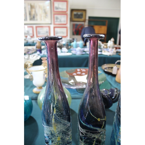 915 - MDINA GLASS BOTTLE VASES three large bottle shaped vases, each with slender necks and square shaped ... 