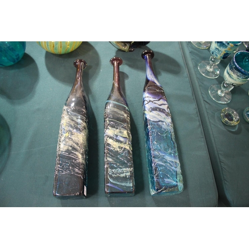 915 - MDINA GLASS BOTTLE VASES three large bottle shaped vases, each with slender necks and square shaped ... 