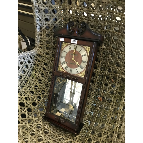 507 - Wall Mounted Cased Pendulum Clock by President