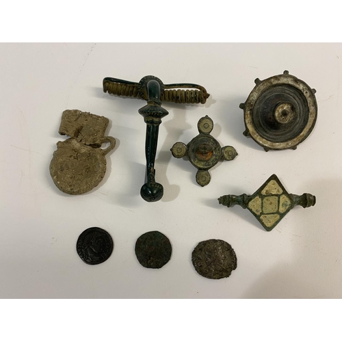 1006 - A SMALL COLLECTION OF ANTIQUITIES. A Roman type bronze Fibula clasp with decorated disc elements and... 