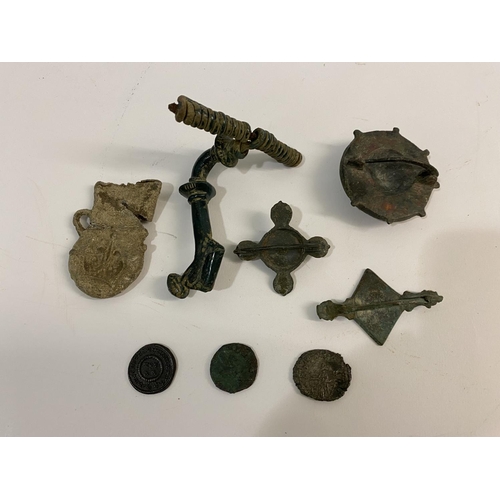 1006 - A SMALL COLLECTION OF ANTIQUITIES. A Roman type bronze Fibula clasp with decorated disc elements and... 