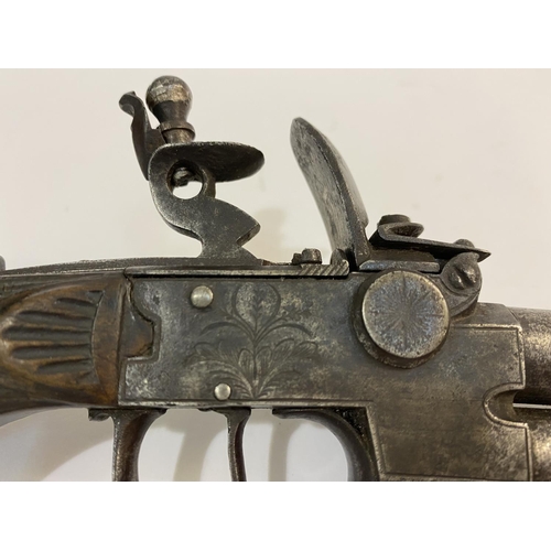 419 - A CONTINENTAL FLINTLOCK DOUBLE BARRELED PISTOL. A continental double over and under barreled pistol ... 