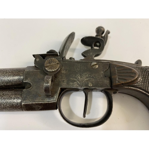 419 - A CONTINENTAL FLINTLOCK DOUBLE BARRELED PISTOL. A continental double over and under barreled pistol ... 