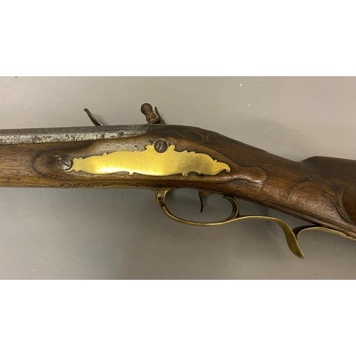 432 - A CONTINENTAL FLINTLOCK RIFLE. A continental rifle with an 84cm barrel tapering from octagonal to ci... 