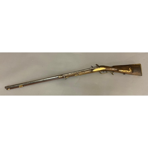 432 - A CONTINENTAL FLINTLOCK RIFLE. A continental rifle with an 84cm barrel tapering from octagonal to ci... 