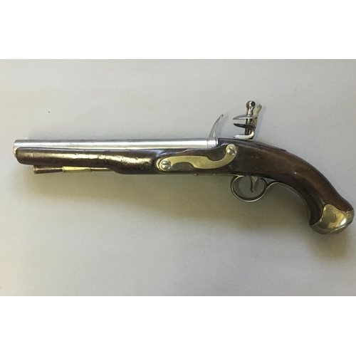 438 - A 19TH CENTURY FLINTLOCK PISTOL. With a 23cm circular tapering barrel stamped with twin proof marks,... 