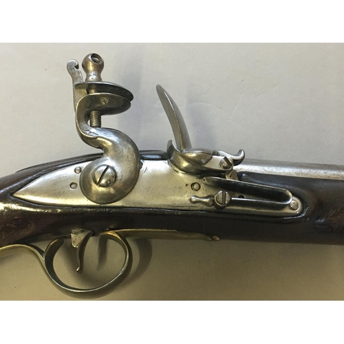 438 - A 19TH CENTURY FLINTLOCK PISTOL. With a 23cm circular tapering barrel stamped with twin proof marks,... 