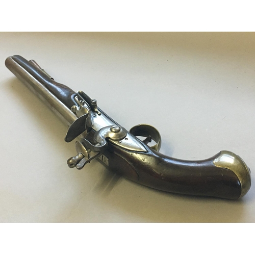 438 - A 19TH CENTURY FLINTLOCK PISTOL. With a 23cm circular tapering barrel stamped with twin proof marks,... 