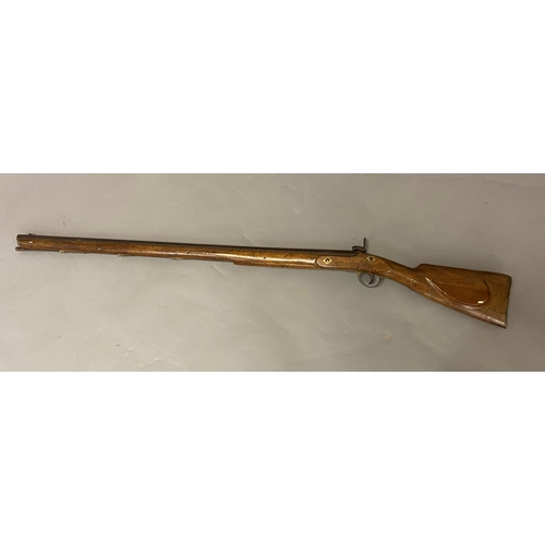 447 - A 19TH CENTURY PERCUSSION FIRING RIFLE. A 19th Century muzzle loading long gun with a 98 cm tapering... 