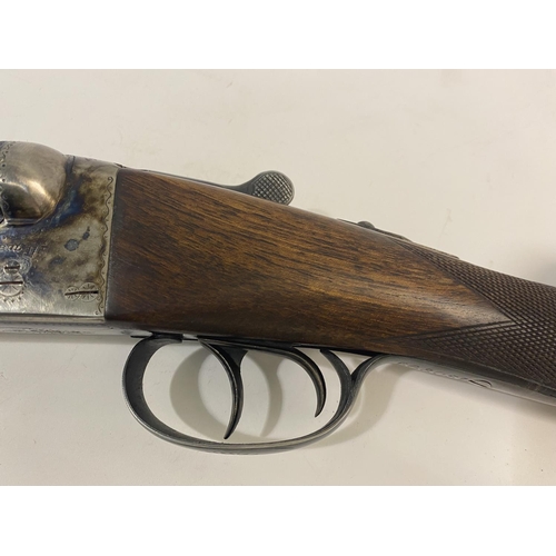 450 - A 20 BORE AYA DOUBLE BARREL SHOTGUN. A 20 bore side by side shotgun with ejector and sliding safety,... 