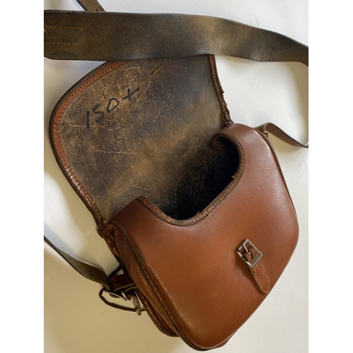 471 - A BROWN LEATHER CARTRIDGE BAG. A light brown shoulder cartridge bag with buckle fastening and should... 