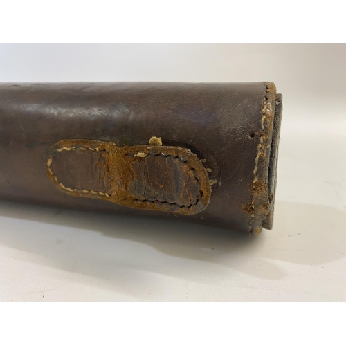 476 - A LEATHER LEG O MUTTON GUN CASE. A brown leather gun case 78 x 24cm overall.