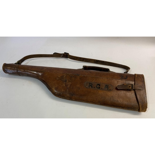 477 - A LEATHER LEG O MUTTON GUN CASE. A brown leather gun case with carrying handle and strap, painted wi... 