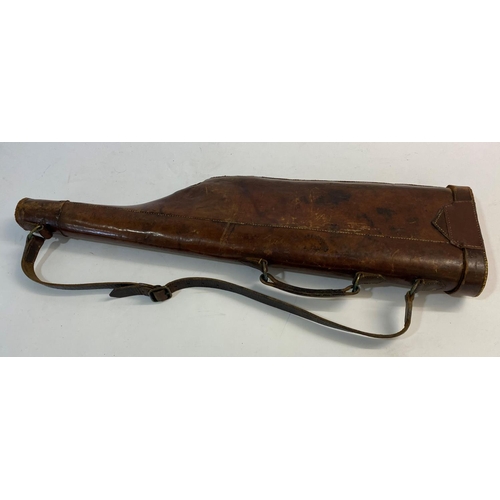 477 - A LEATHER LEG O MUTTON GUN CASE. A brown leather gun case with carrying handle and strap, painted wi... 