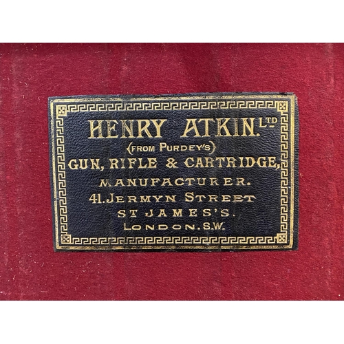 479 - A LEATHER CARTRIDGE CASE BY ATKIN FROM PURDET'S. A leather cartridge case with brass mounted corners... 