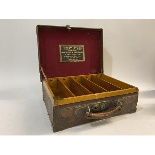 479 - A LEATHER CARTRIDGE CASE BY ATKIN FROM PURDET'S. A leather cartridge case with brass mounted corners... 