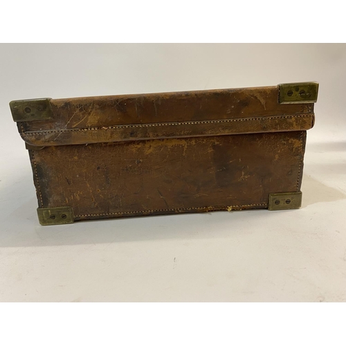 479 - A LEATHER CARTRIDGE CASE BY ATKIN FROM PURDET'S. A leather cartridge case with brass mounted corners... 