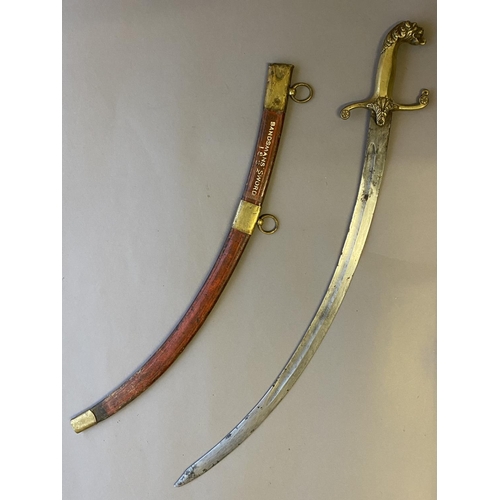 493 - AN EARLY 19TH CENTURY BANDSMANS' SCIMITAR. With a 67cm curved, fullered and pointed blade, the handl... 