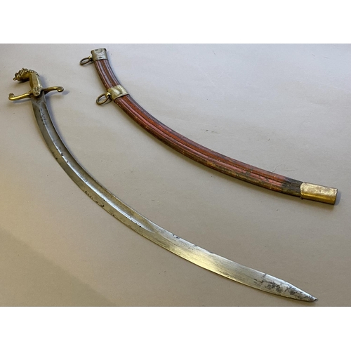 493 - AN EARLY 19TH CENTURY BANDSMANS' SCIMITAR. With a 67cm curved, fullered and pointed blade, the handl... 