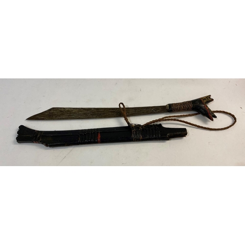 539 - A BORNEO DYACK 'HEAD HUNTERS' SWORD AND SCABBARD. A sword with a 44cm shaped pointed blade with shar... 