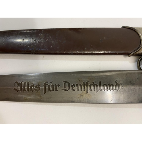 543 - A SECOND WORLD WAR GERMAN SA DAGGER AND SCABBARD BY EICKHORN. An SA dagger with a 22cm pointed blade... 