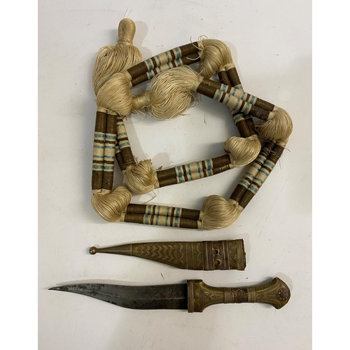 563 - A SMALL KNIFE AND SCABBARD AND HEAD DRESS BAND. An African knife with a double edged 14.5cm curved b... 