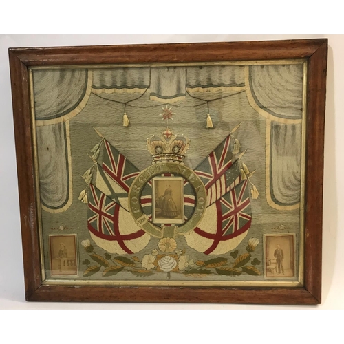 596 - A VICTORIAN SAILOR'S WOOL WORK 'FORGET ME NOT'. The woolwork mounted with a central panel of a Victo... 