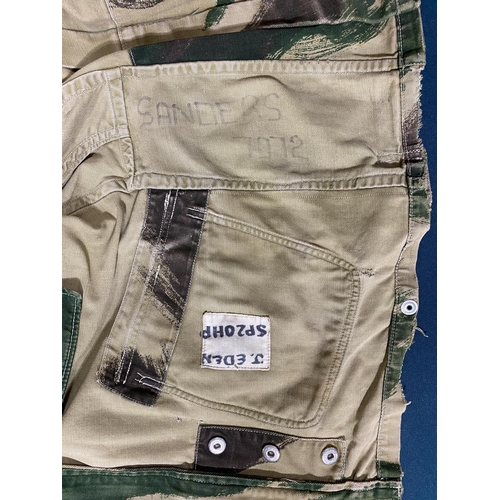 597 - A 1959 PATTERN DENNISON COMBAT SMOCK. With a four pocket zip front, with signs of use and repairs, w... 