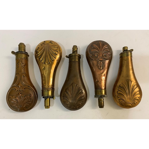 678 - A COLLECTION OF FIVE BRASS AND COPPER POWDER FLASKS BY BARTRAM AND OTHERS. A brass and copper powder... 