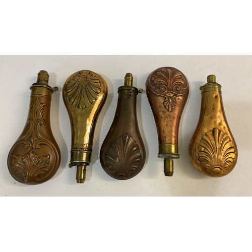 678 - A COLLECTION OF FIVE BRASS AND COPPER POWDER FLASKS BY BARTRAM AND OTHERS. A brass and copper powder... 