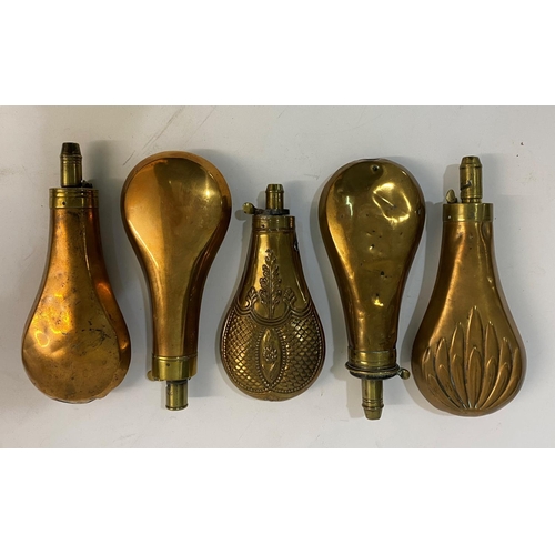 679 - A COLLECTION OF FIVE BRASS AND COPPER POWDER FLASKS BY SYKES AND OTHERS. A brass mounted powder flas... 