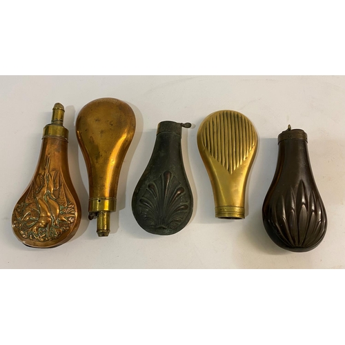 680 - A COLLECTION OF FIVE BRASS AND COPPER POWDER FLASKS. Five similar brass and copper powder flasks wit... 