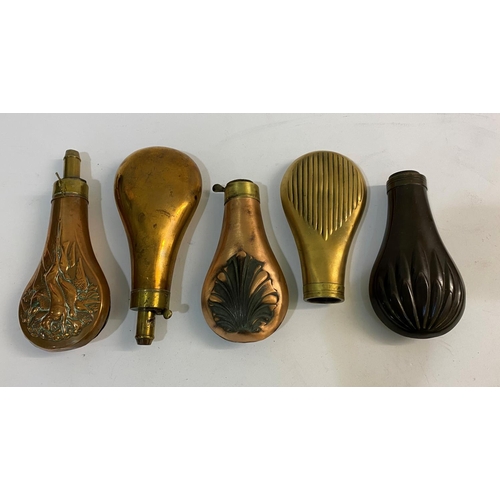 680 - A COLLECTION OF FIVE BRASS AND COPPER POWDER FLASKS. Five similar brass and copper powder flasks wit... 