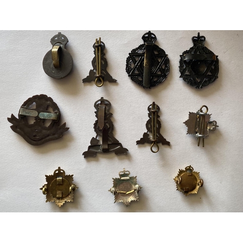 795 - A COLLECTION OF SECOND WORLD WAR ECONOMY BADGES. Bakelite cap badges for the Army Catering Corps and... 