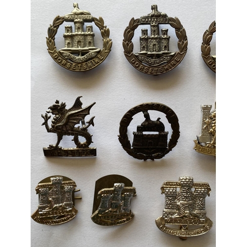 796 - A COLLECTION OF DORSET REGIMENT CAP BADGES AND SIMILAR. A selection of Dorset Regiment Cap badges an... 