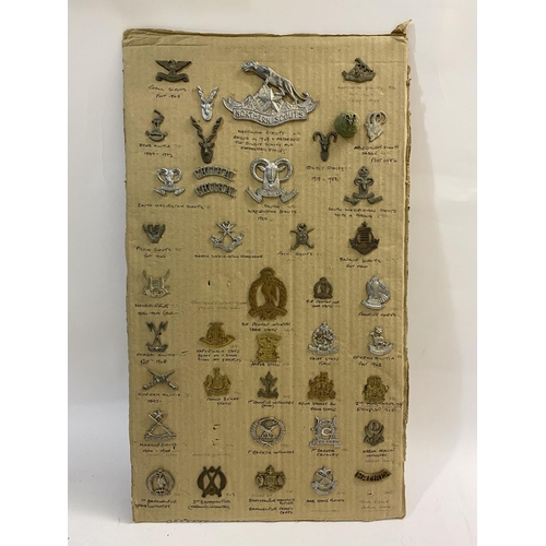 797 - A COLLECTION OF INDIAN STATES MILITARY INSIGNIA. A collection of cap badges and similar to include a... 