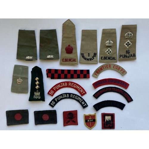 799 - A COLLECTION OF INDIAN ARMY CLOTH BADGES AND INSIGNIA. An interesting collection of cloth badges to ... 