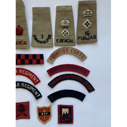 799 - A COLLECTION OF INDIAN ARMY CLOTH BADGES AND INSIGNIA. An interesting collection of cloth badges to ... 