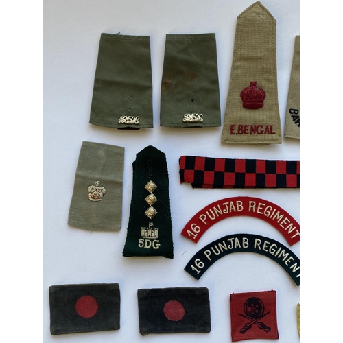 799 - A COLLECTION OF INDIAN ARMY CLOTH BADGES AND INSIGNIA. An interesting collection of cloth badges to ... 