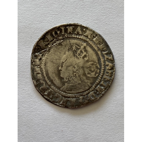 999 - AN ELIZABETH I SHILLING. An Elizabeth I hammered silver Shilling, third or fourth issue, obverse wit... 