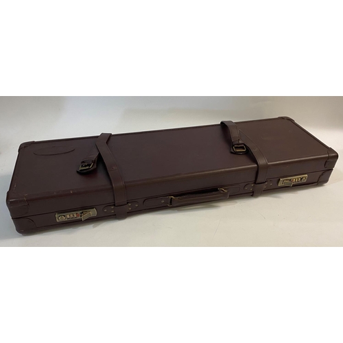 475 - A LEATHER 'BUFFALO RIVER' GUN CASE. A rectangular leather gun case with twin combination locks and s... 